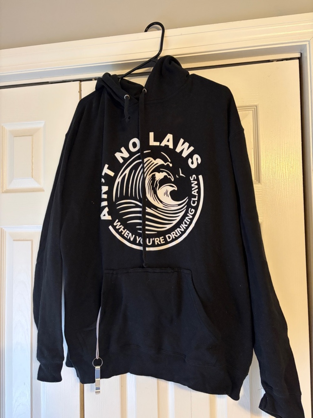 White Claw J. America Black Pullover Hoodie with White Wave Graphic